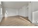 Bright and spacious living room with neutral walls and modern wood-look flooring at 8416 Kawala Dr, Las Vegas, NV 89128