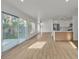 Open-concept floor plan with sleek wood flooring and abundant natural light at 8416 Kawala Dr, Las Vegas, NV 89128