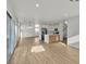Open-concept floor plan with sleek wood flooring and abundant natural light at 8416 Kawala Dr, Las Vegas, NV 89128