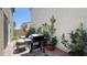 Backyard with modern outdoor furniture, a grill, and lush landscaping at 9136 Eagle Ford St, Las Vegas, NV 89113