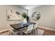 Elegant dining room featuring modern table and chairs beneath stylish lighting and decor at 9136 Eagle Ford St, Las Vegas, NV 89113