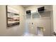 Bright laundry room featuring a wire shelf and a neutral color palette at 9136 Eagle Ford St, Las Vegas, NV 89113
