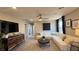 Cozy living room offers a sectional sofa, plush carpet, and modern decor at 9136 Eagle Ford St, Las Vegas, NV 89113
