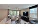 Inviting living room with plush seating, large windows, and modern entertainment center creating a relaxing atmosphere at 9136 Eagle Ford St, Las Vegas, NV 89113