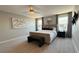 Beautiful bedroom features stylish decor, soft lighting and a cozy king size bed at 9136 Eagle Ford St, Las Vegas, NV 89113