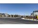 New neighborhood entrance with lush landscaping and clear signage to welcome residents at 9136 Eagle Ford St, Las Vegas, NV 89113