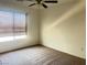 Bedroom with window and ceiling fan at 9299 Adamshurst Ave, Las Vegas, NV 89148