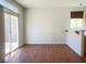 Living room with hardwood floors and sliding glass door to backyard at 9299 Adamshurst Ave, Las Vegas, NV 89148