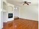 Hardwood floors in living room featuring a recessed fireplace at 9299 Adamshurst Ave, Las Vegas, NV 89148
