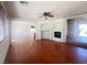Open living room features recessed fireplace and hardwood floors at 9299 Adamshurst Ave, Las Vegas, NV 89148