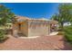 Backyard features a pergola-covered patio, desert landscaping, and privacy fence at 9717 Buckhorn Dr, Las Vegas, NV 89134