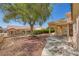 Well-maintained backyard with a mature tree and covered patio, offering a serene outdoor space at 9717 Buckhorn Dr, Las Vegas, NV 89134