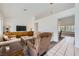 Living room with comfortable seating, tiled floor entry, and a view into the eat-in kitchen at 9717 Buckhorn Dr, Las Vegas, NV 89134