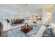 Open-concept space features an attached dining room, a living room, and tile flooring at 9717 Buckhorn Dr, Las Vegas, NV 89134