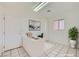 Bright office space featuring white walls, tile flooring, and a modern desk setup, perfect for a productive work environment at 9717 Buckhorn Dr, Las Vegas, NV 89134