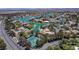Desirable neighborhood featuring waterfront homes, mature trees, and a community tennis facility at 2821 Whispering Wind Dr, Las Vegas, NV 89117