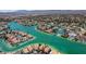 Magnificent aerial view showcasing the waterfront homes, canals, and manicured landscaping in this desirable community at 2821 Whispering Wind Dr, Las Vegas, NV 89117