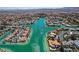 Breathtaking aerial view of a luxury community with waterfront homes, lush landscaping, and picturesque waterways at 2821 Whispering Wind Dr, Las Vegas, NV 89117
