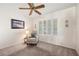 Comfortable bedroom area with chair, table and shuttered windows, creating a cozy and inviting atmosphere at 2821 Whispering Wind Dr, Las Vegas, NV 89117