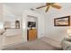 Cozy bedroom area leading to other room features tile floor and view of fireplace at 2821 Whispering Wind Dr, Las Vegas, NV 89117