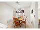 Cozy dining nook with a view to the kitchen and natural light at 2821 Whispering Wind Dr, Las Vegas, NV 89117