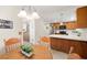 Eat-in kitchen with stainless steel appliances and wooden cabinets at 2821 Whispering Wind Dr, Las Vegas, NV 89117