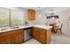 Corner view of a kitchen with stainless steel dishwasher and marble countertop at 2821 Whispering Wind Dr, Las Vegas, NV 89117