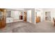 Spacious living area featuring tile flooring, lots of natural light, and open layout at 2821 Whispering Wind Dr, Las Vegas, NV 89117