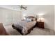 Bedroom with french doors, ceiling fan, and neutral decor at 2821 Whispering Wind Dr, Las Vegas, NV 89117