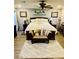 Spacious bedroom features a king-size bed, ceiling fan, and light gray accent walls with framed paintings at , Las Vegas, NV 89141