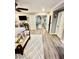 Spacious main bedroom with hardwood style flooring, sitting area, and multiple doorways at , Las Vegas, NV 89141
