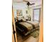 Comfortable bedroom with a ceiling fan, window, and artful wall decor at , Las Vegas, NV 89141