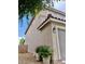 View of a side of the home with stucco and desert landscaping including potted plants at , Las Vegas, NV 89141