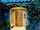 Inviting front porch with an ornate security door and lush flowering vines, creating a warm welcome at , Las Vegas, NV 89141