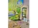 An arched entryway adorned with lush greenery leads to a charming home, framed by manicured landscaping at , Las Vegas, NV 89141