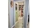 Hallway view into organized closet with custom shelves, drawers, and hanging rods at , Las Vegas, NV 89141