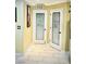 Hallway view featuring a decorative laundry room door with frosted glass and a pantry door with decorative glass at , Las Vegas, NV 89141