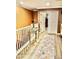 Upstairs hallway with laminate floors, white railings, neutral paint and access to bedrooms and living spaces at , Las Vegas, NV 89141
