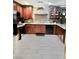 A kitchen featuring dark wood cabinets, granite countertops, stainless steel appliances, and tile flooring at , Las Vegas, NV 89141