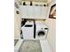 A tidy laundry room is equipped with modern appliances, cabinet storage, and stylish rugs for comfort at , Las Vegas, NV 89141