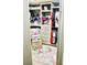 Organized walk-in closet with custom shelves, drawers, seating, and decor at , Las Vegas, NV 89141