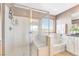 Elegant bathroom featuring walk-in shower and separate tub at 1000 Cetona Ct, Henderson, NV 89011