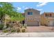 Charming two-story home with a paver driveway and low-maintenance desert landscaping at 1000 Cetona Ct, Henderson, NV 89011