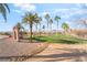 Community golf course entrance with stacked stone monument sign and desert landscaping at 1000 Cetona Ct, Henderson, NV 89011