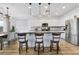 Beautiful kitchen with an island, stainless steel appliances and modern pendant lighting at 1000 Cetona Ct, Henderson, NV 89011