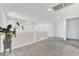 Bright upstairs loft area with modern railing and neutral carpet at 1000 Cetona Ct, Henderson, NV 89011