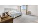 Spacious main bedroom with large bed, upholstered headboard, and scenic window at 1000 Cetona Ct, Henderson, NV 89011
