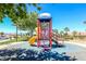 Neighborhood playground featuring a colorful slide and climbing structure for outdoor play at 1000 Cetona Ct, Henderson, NV 89011