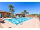Bright swimming pool with six lanes, a shaded cabana, and lounge chairs for relaxing by the pool at 1000 Cetona Ct, Henderson, NV 89011