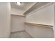 Walk-in closet with carpeted floors and shelves for storage at 1000 Cetona Ct, Henderson, NV 89011